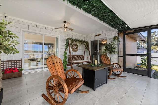 sunroom / solarium with ceiling fan