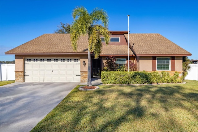 view of front facade featuring a front yard and a garage