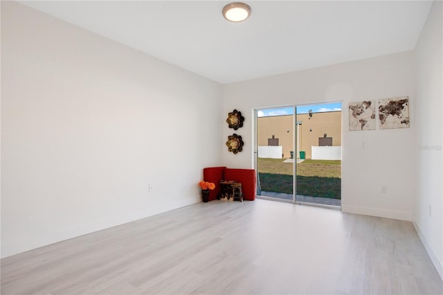 spare room with light wood-type flooring