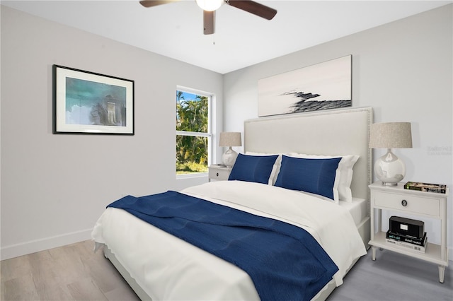 bedroom featuring light hardwood / wood-style floors and ceiling fan