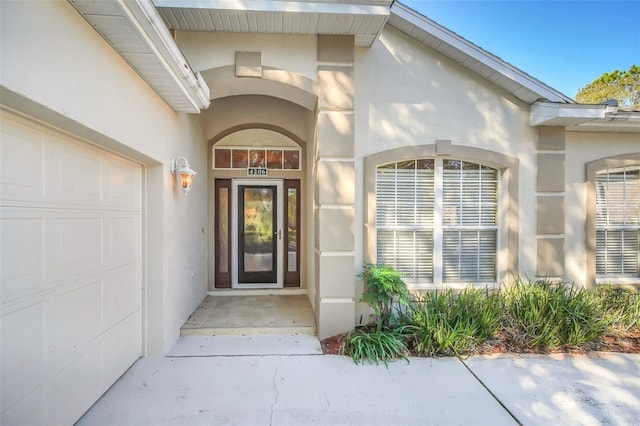 doorway to property featuring a garage