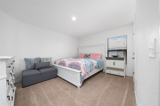 bedroom featuring light colored carpet