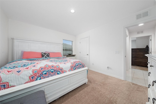 bedroom with light carpet