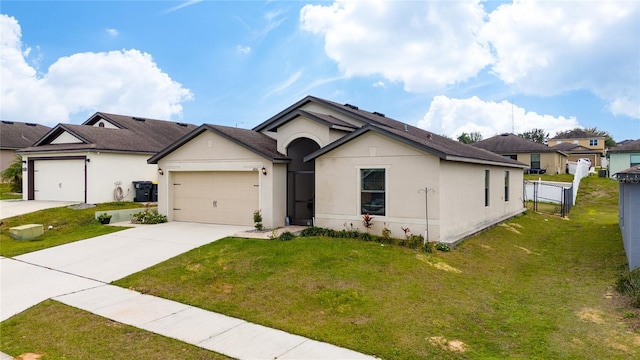 view of front of home with a garage and a front yard