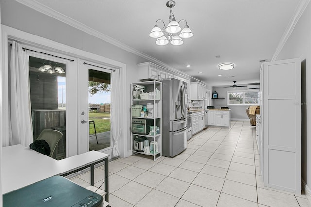 kitchen with sink, white cabinets, ceiling fan with notable chandelier, and appliances with stainless steel finishes