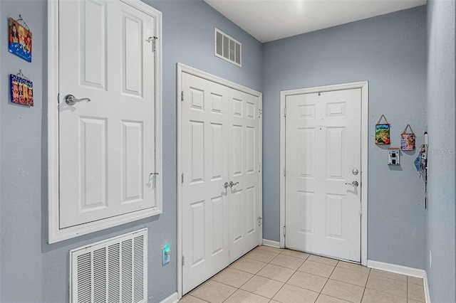 foyer with light tile patterned floors