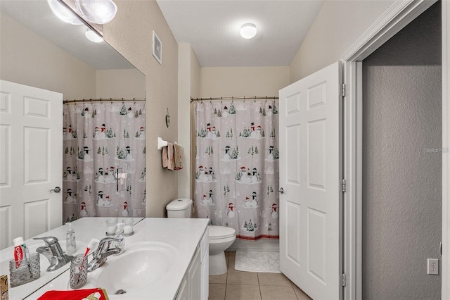 bathroom with toilet, vanity, a shower with curtain, and tile patterned flooring