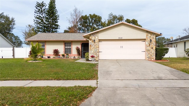 ranch-style house featuring a front lawn and a garage