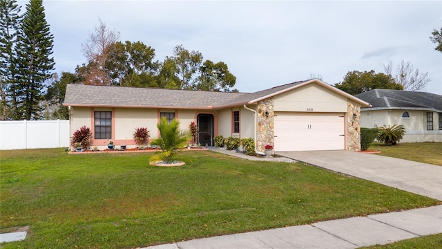 single story home with a front yard and a garage