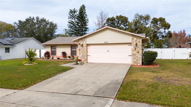 ranch-style house featuring a front lawn and a garage