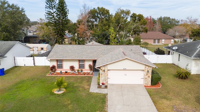 view of front facade with a garage and a front yard