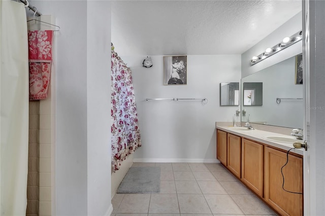 bathroom with vanity, a textured ceiling, tile patterned floors, and shower / bath combo with shower curtain