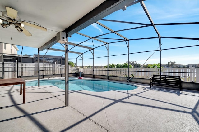 view of swimming pool featuring a patio area, ceiling fan, and a lanai