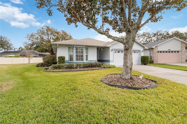 single story home featuring a front lawn and a garage