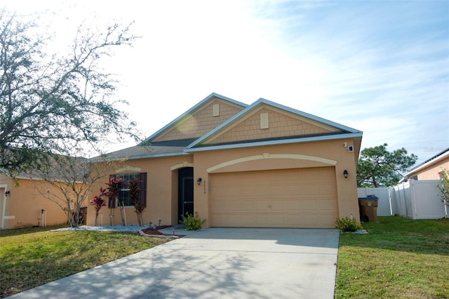 view of front of property with a front lawn and a garage