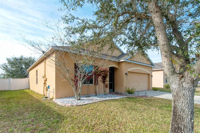 view of front of house featuring a front yard and a garage