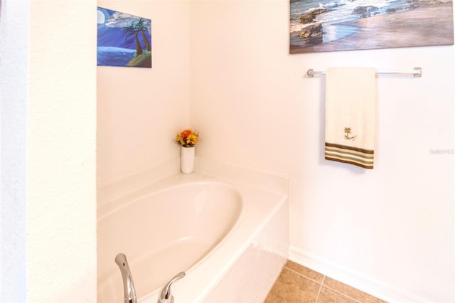 bathroom featuring tile patterned floors and a bathing tub