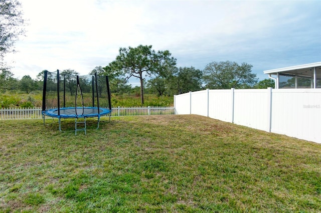 view of yard with a trampoline