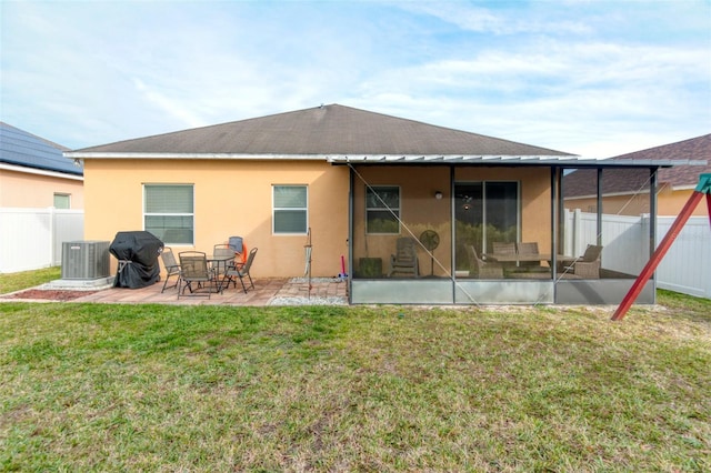 back of property featuring a yard, a patio, and central air condition unit