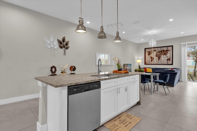 kitchen with decorative light fixtures, dishwasher, white cabinets, and a kitchen island with sink