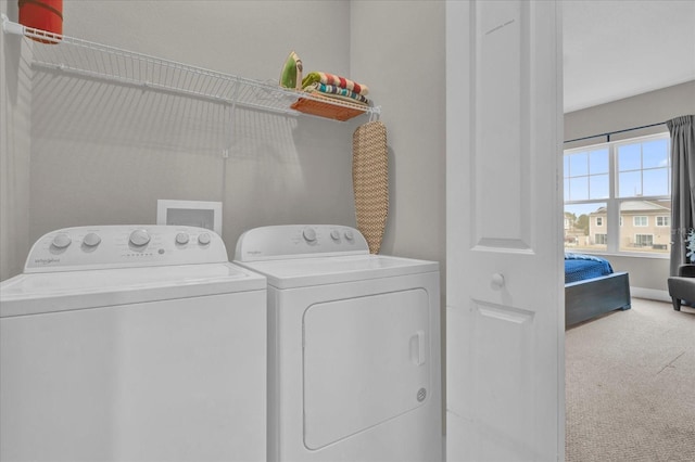 laundry room featuring separate washer and dryer and carpet flooring