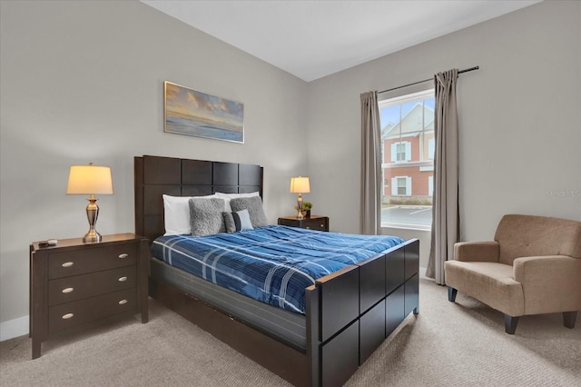 bedroom with light colored carpet