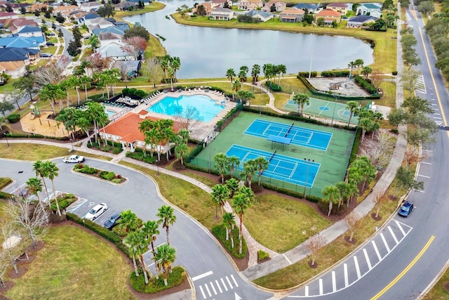 birds eye view of property featuring a water view