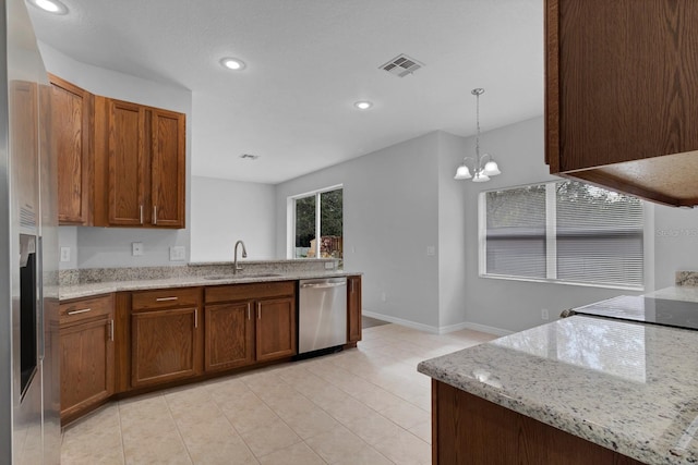 kitchen with a chandelier, light stone countertops, sink, decorative light fixtures, and stainless steel dishwasher