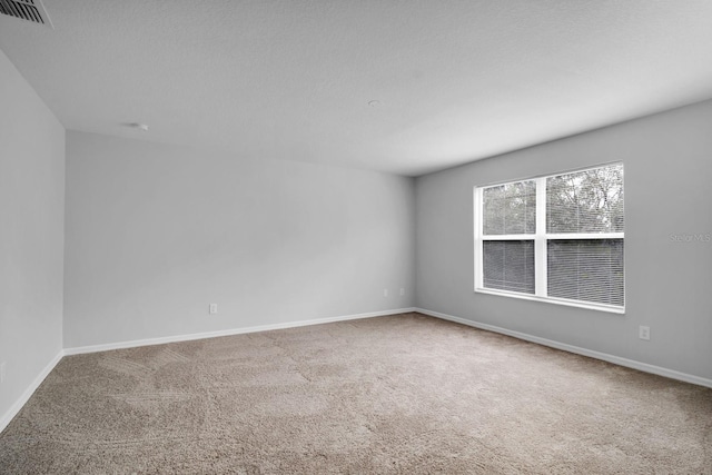 unfurnished room with carpet flooring