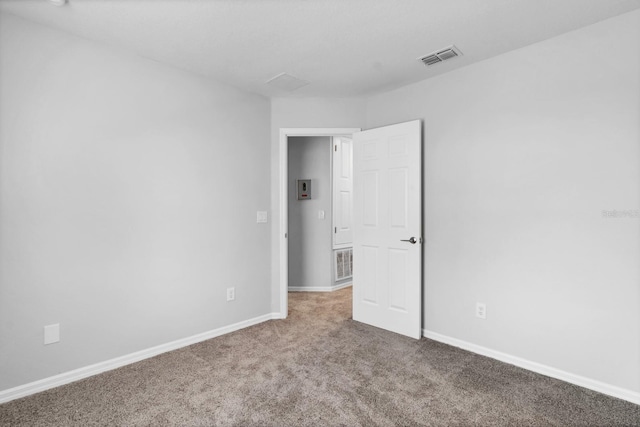 empty room featuring carpet flooring