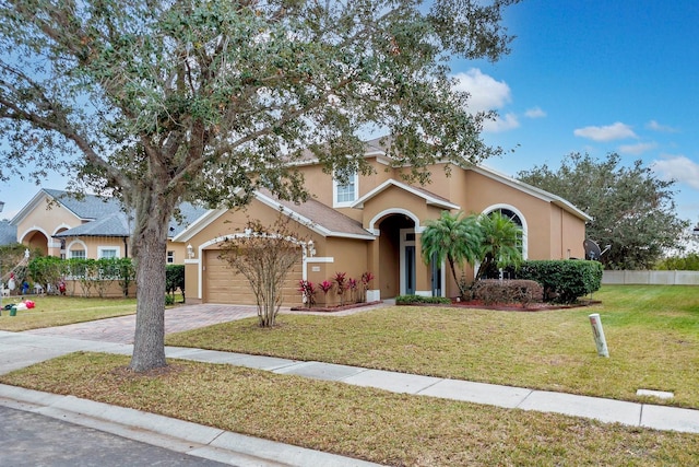 view of front facade with a garage and a front yard