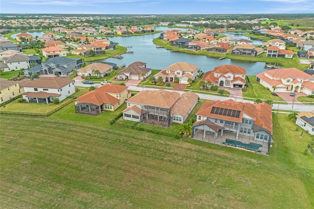 birds eye view of property with a residential view and a water view