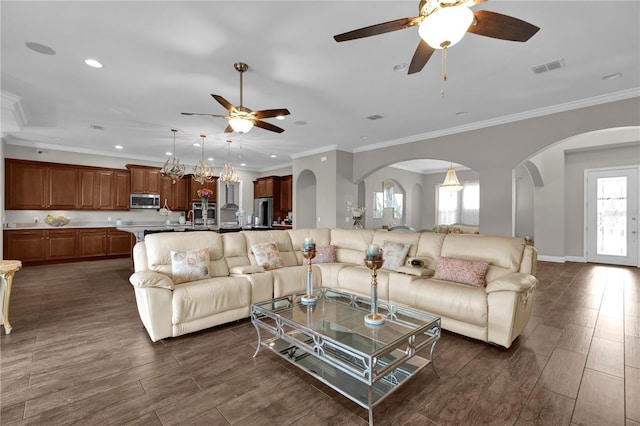 living area featuring visible vents, a ceiling fan, wood tiled floor, crown molding, and recessed lighting