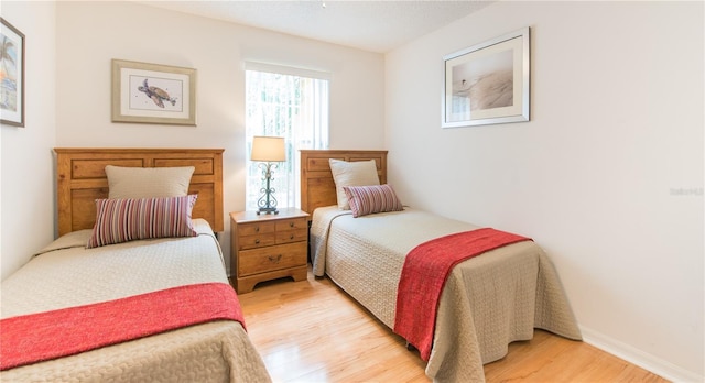 bedroom with light hardwood / wood-style floors