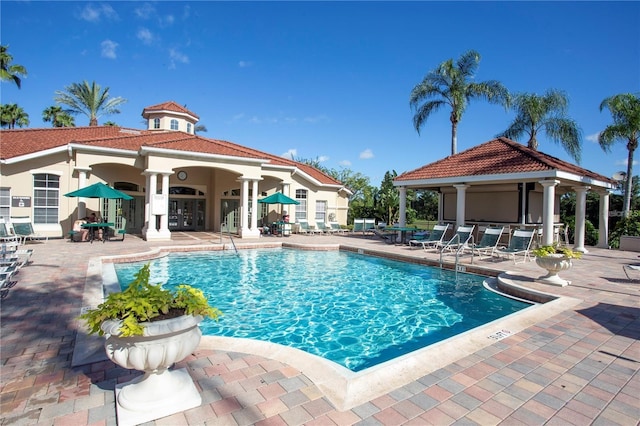 view of swimming pool with a patio