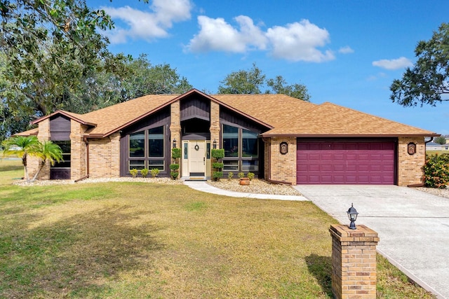 ranch-style home featuring a front lawn and a garage