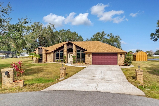 ranch-style house with a front yard and a garage