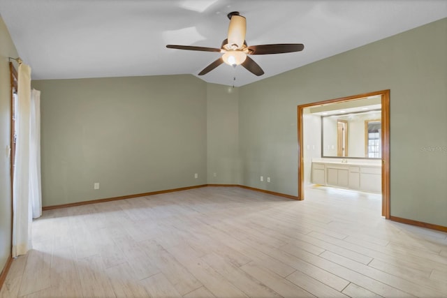 unfurnished room featuring vaulted ceiling, ceiling fan, and light hardwood / wood-style floors