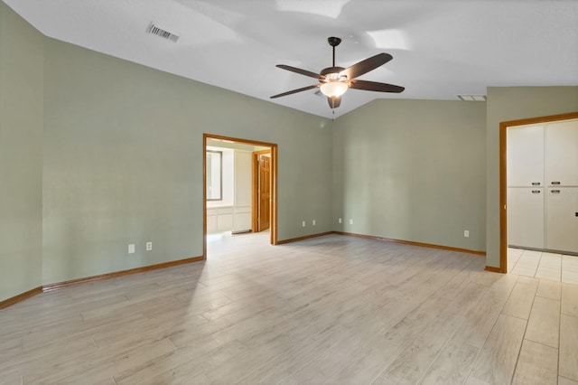 spare room featuring lofted ceiling, ceiling fan, and light hardwood / wood-style floors