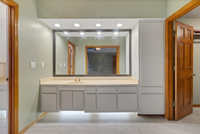 bathroom with ceiling fan and vanity