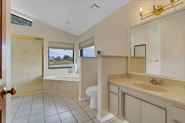 bathroom with a tub to relax in, tile patterned flooring, a healthy amount of sunlight, and vaulted ceiling