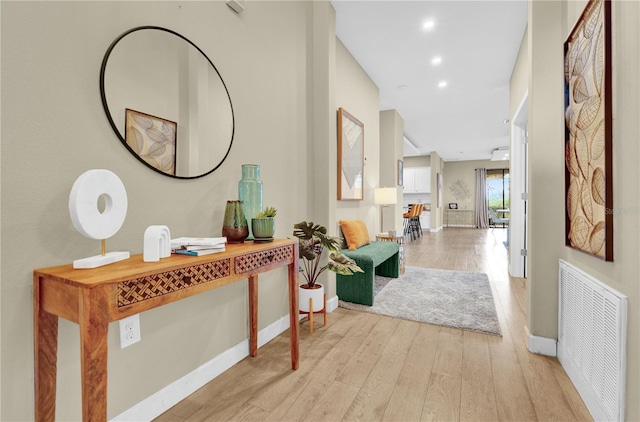 hallway with light wood-type flooring