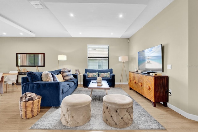 living room with light hardwood / wood-style flooring