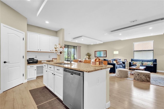 kitchen with white cabinetry, a center island, and dishwasher