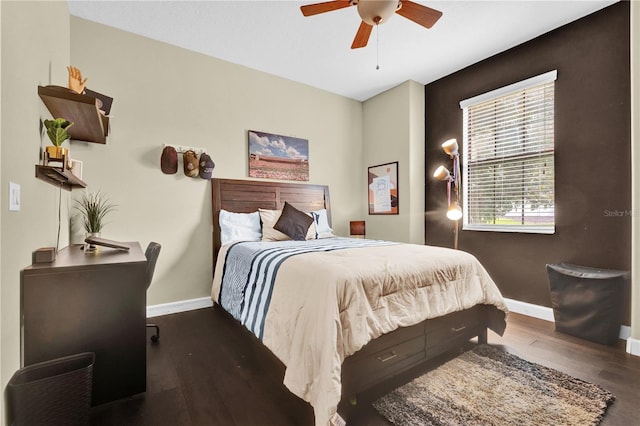 bedroom with dark wood-type flooring and ceiling fan