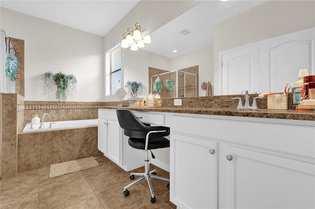 bathroom with tile patterned flooring, vanity, and separate shower and tub