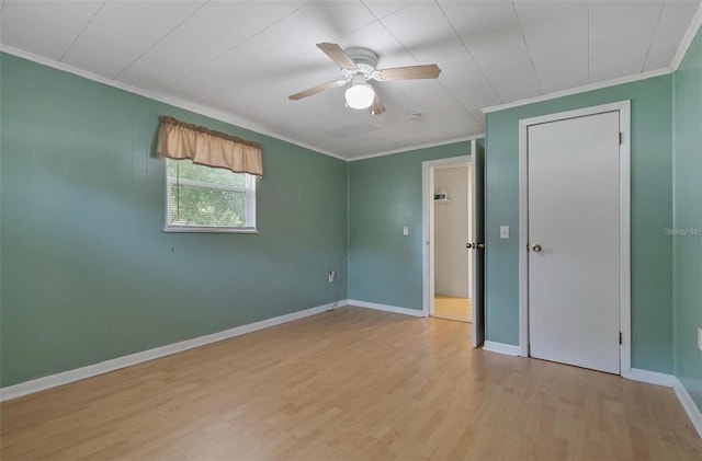 unfurnished bedroom featuring ceiling fan, ornamental molding, and light hardwood / wood-style floors