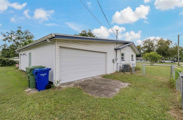 garage featuring a lawn