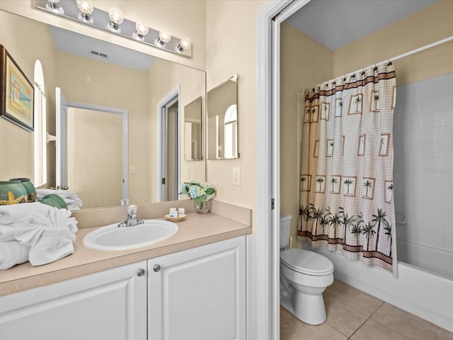 full bathroom with shower / bathtub combination with curtain, vanity, tile patterned floors, and toilet