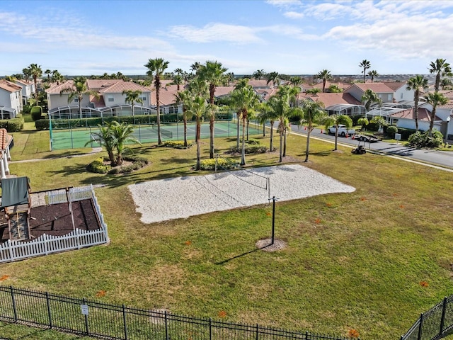 surrounding community with volleyball court, tennis court, and a yard